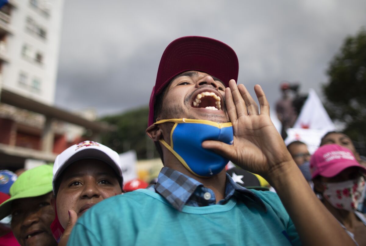 A supporter of Venezuelan President Nicolás Maduro shouts in support at a campaign rally in Caracas.