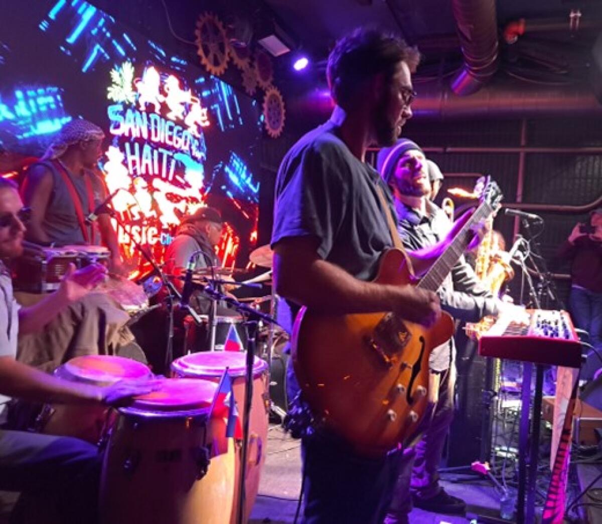 Boostive performs a surprise set at the "San Diego for Haiti" benefit concert at The Holding Co. in Ocean Beach.