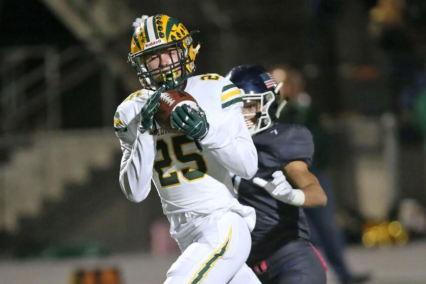 Edison's Jack Kosick strides into the end zone after catching a pass from Braeden Boyles for a touchdown in first half against Newport Harbor on Thursday night.