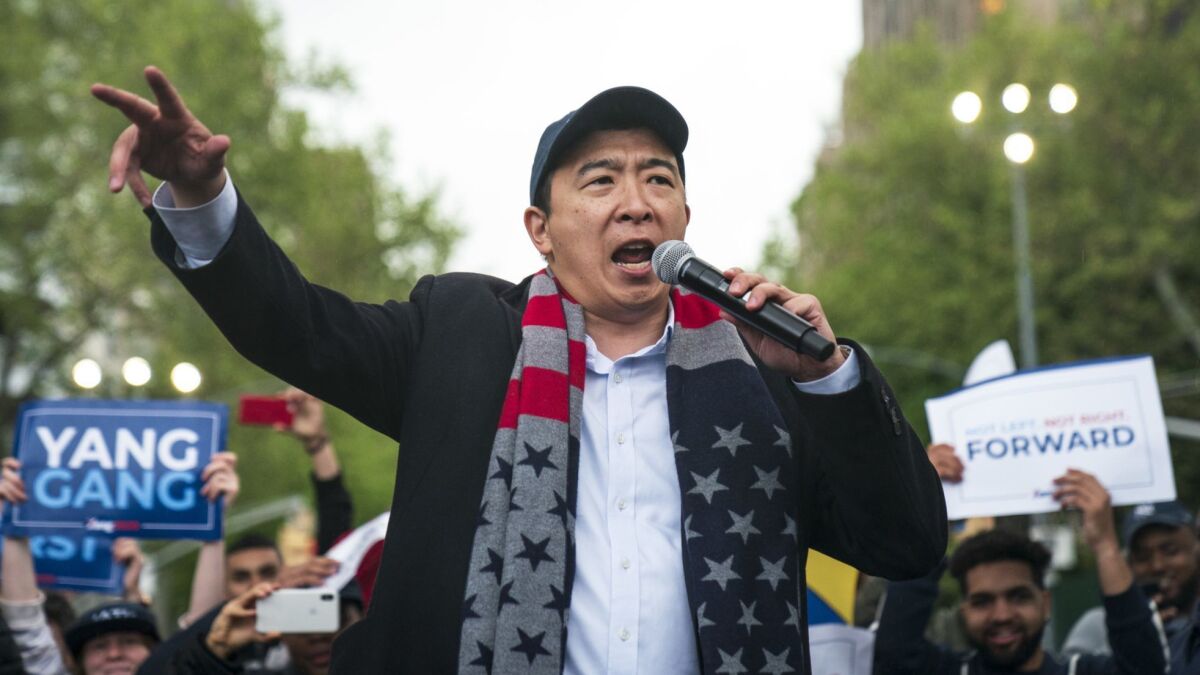 Entrepreneur Andrew Yang, shown at a May rally in New York, polls higher than some senators and governors in the race. But he only spoke for three minutes during last months' debate and didn't make much of that limited time.