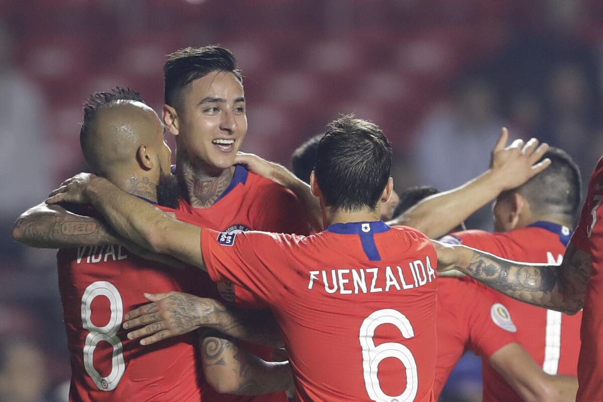 Chile's Erick Pulgar, second from left, celebrates with teammates after scoring the opening goal against Japan during a Copa America Group C soccer match at the Morumbi stadium in Sao Paulo, Brazil, Monday, June 17, 2019.