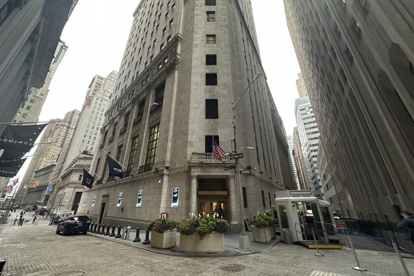 FILE - The entrance to the New York Stock Exchange at Wall and New Streets is shown on Oct. 2, 2024, in New York. (AP Photo/Peter Morgan, File)