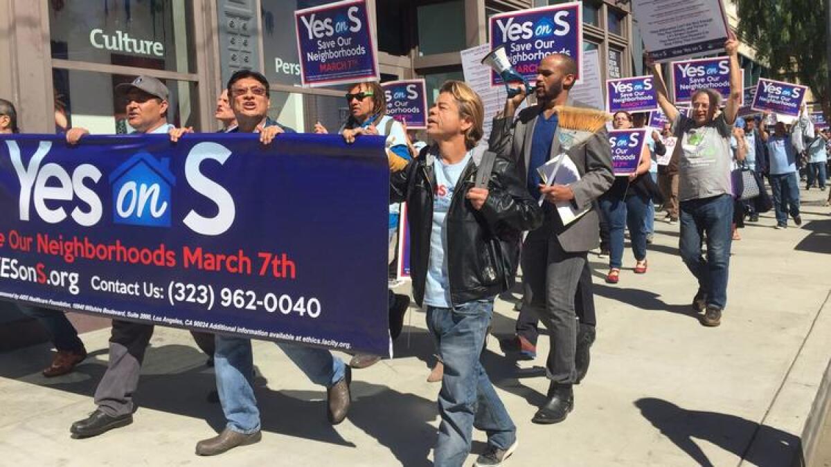 Supporters of Measure S march toward Los Angeles City Hall on Monday.