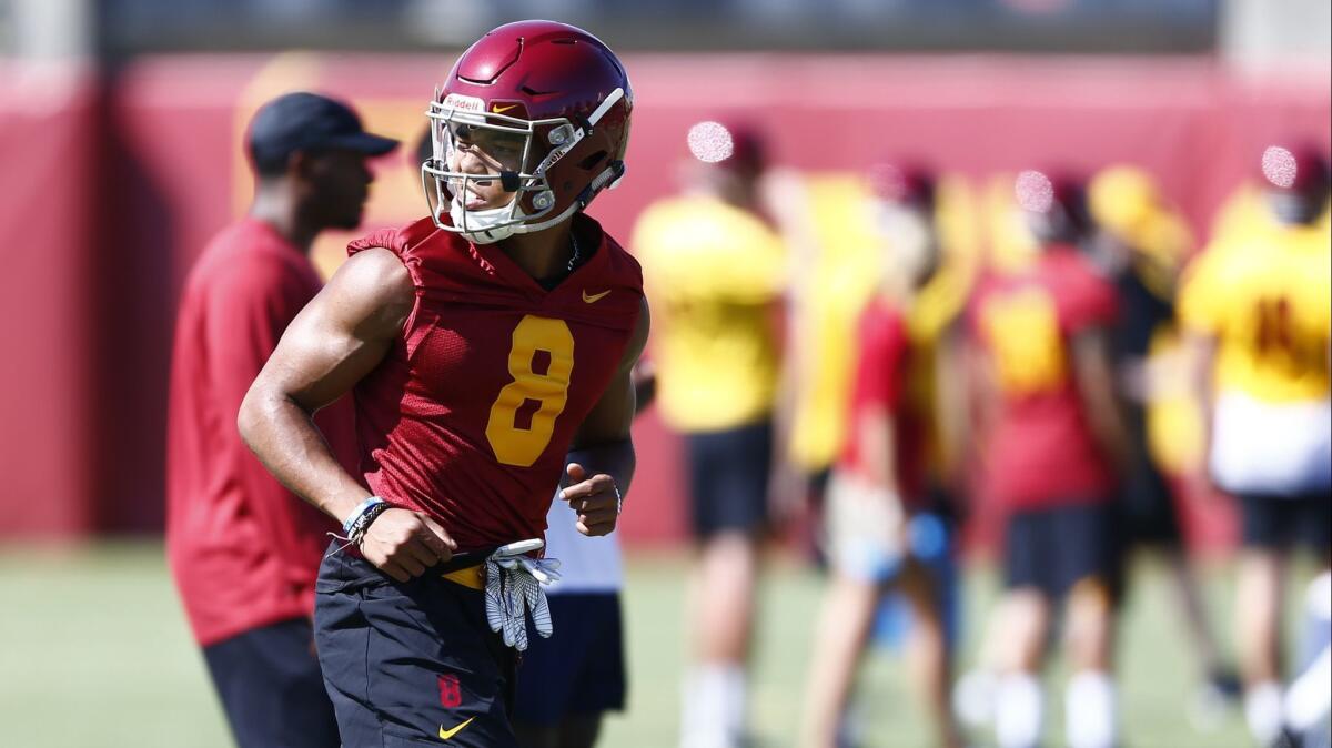 USC wide receiver Amon-Ra St. Brown walks on the field as the Trojans open up fall camp on Friday.