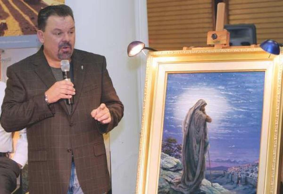 Thomas Kinkade, with his painting "Prayer for Peace," in 2006. He died in April at age 54.