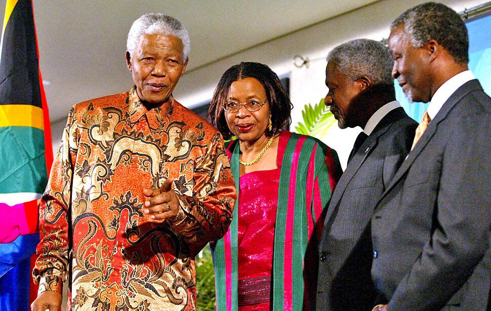 Former President Nelson Mandela and his wife, Graca Machel, join United Nations Secretary-General Kofi Annan and President Thabo Mbeki on stage at the World Summit on Sustainable Development on Sept. 2, 2002.