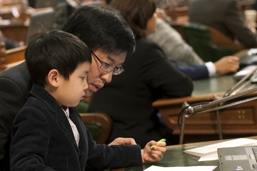 California Sen. Richard Pan, shown with his son William in 2010, says: "As a pediatrician, I have personally witnessed children suffering lifelong injury and death from vaccine-preventable infection."