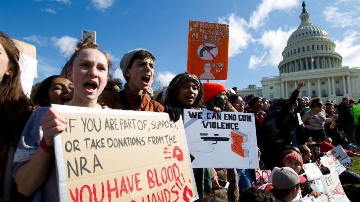 Students participate in a rally calling for more gun control outside the Capitol building in Washington on March 14.