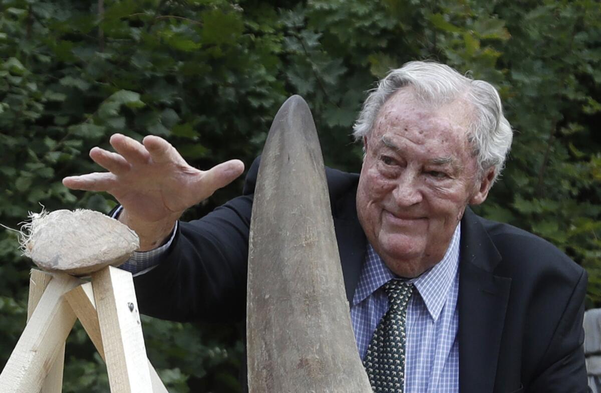 Kenyan paleoanthropologist Richard Leakey with a rhino horn