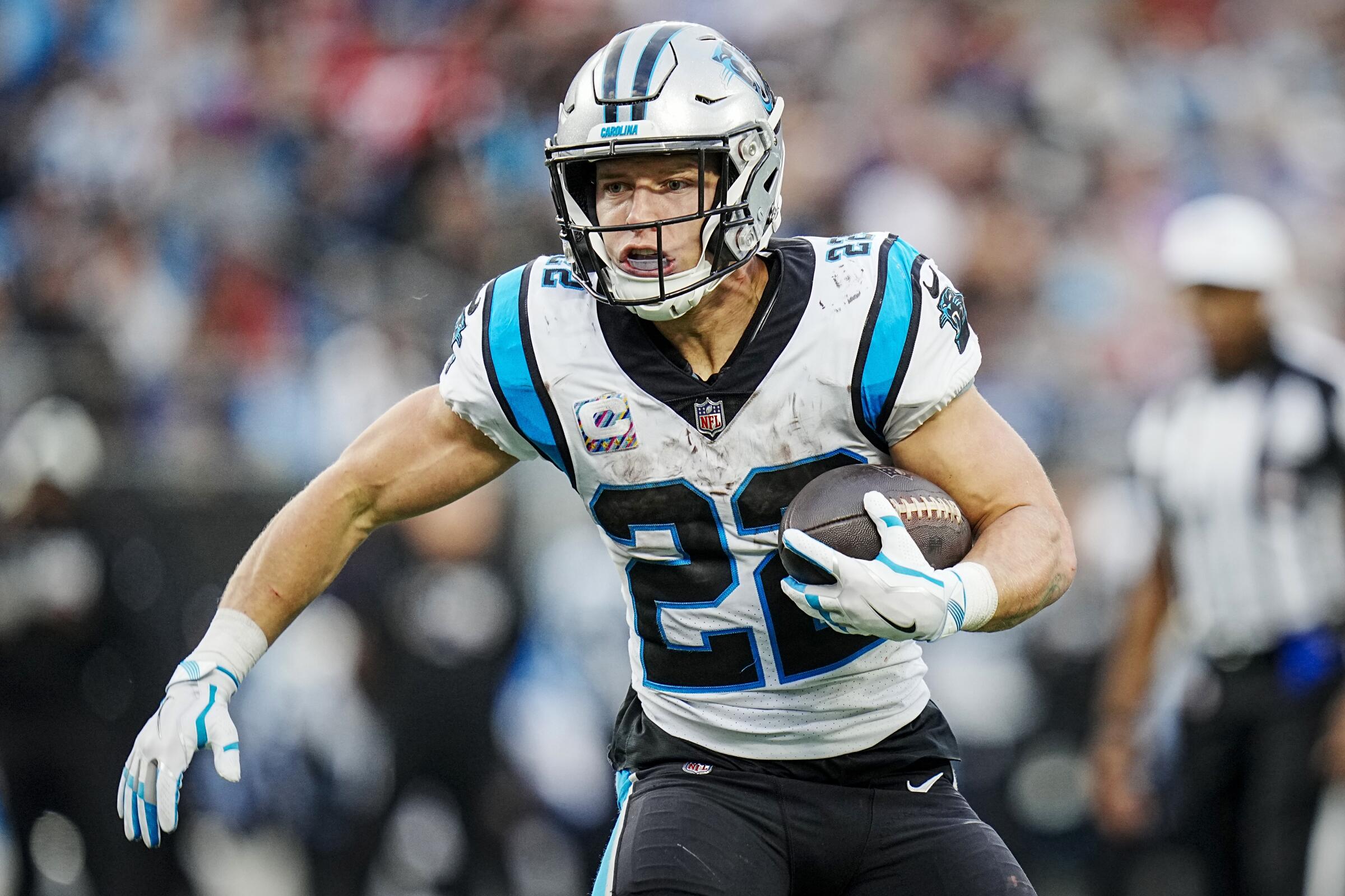 Carolina Panthers running back Christian McCaffrey carries the ball Oct. 9, 2022, against the San Francisco 49ers.