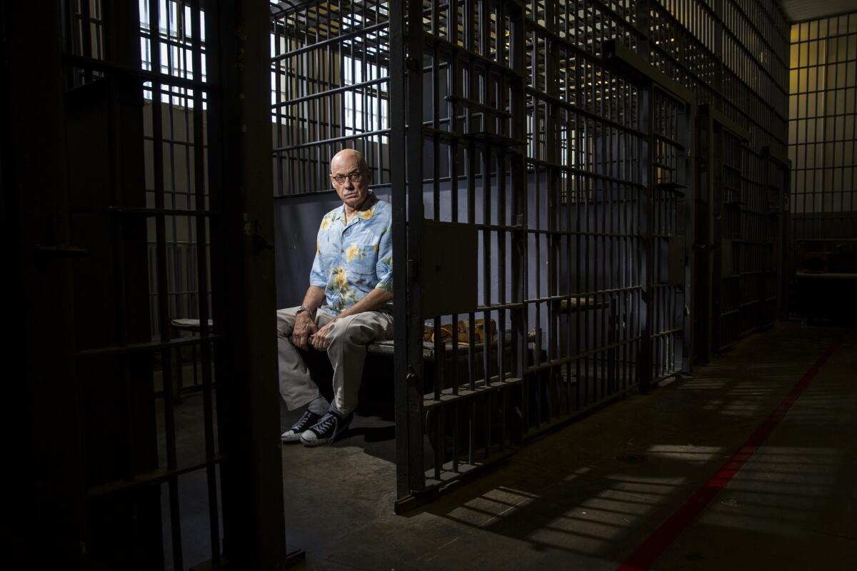 Author James Ellroy inside a replica jail cell at the Los Angeles Police Museum.