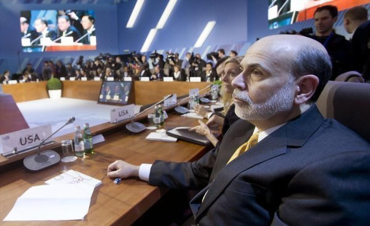 Federal Reserve Chairman Ben S. Bernanke defended the Fed's monetary policies at a session with finance ministers and central banks Friday at the Group of 20 meeting in Moscow.