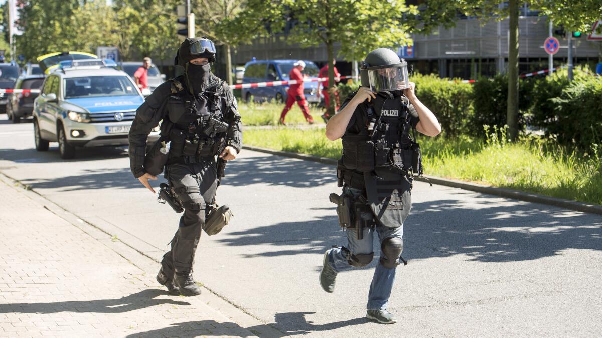 Police converge on a movie theater complex in Viernheim, Germany, where an armed man took hostages and was killed by police.