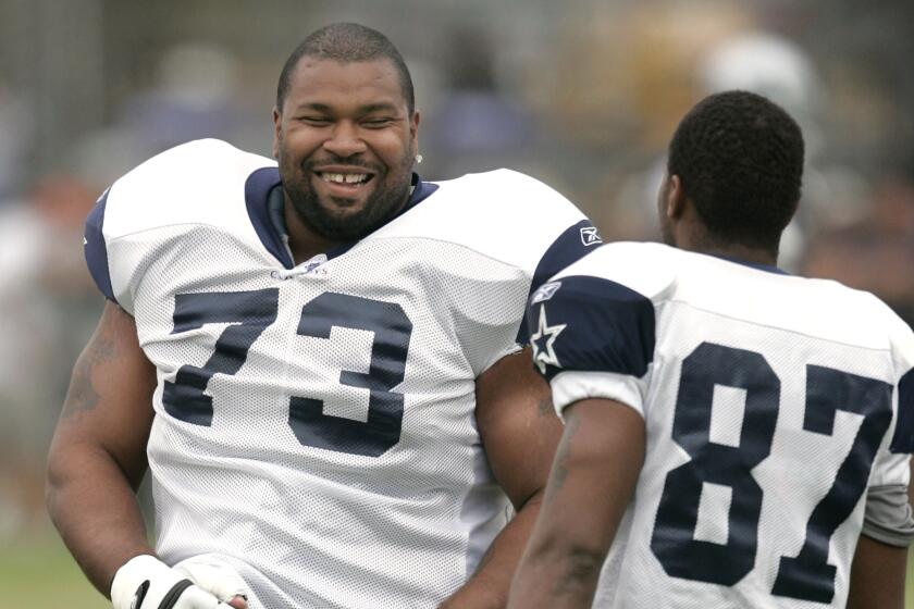 FILE - In this Aug. 1, 2005, file photo, Dallas Cowboys guard Larry Allen (73) shares a laugh.