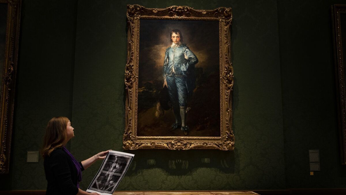 Christina O'Connell looks up at "The Blue Boy," on the wall of the Huntington's Thornton Portrait Gallery in mid-August, a month before conservation treatment begins.
