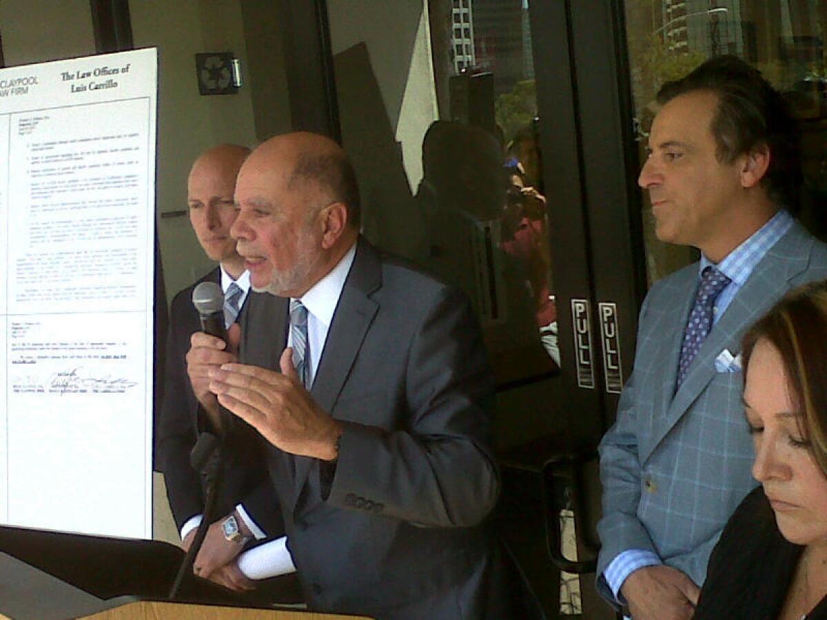 Attorneys, from left, Vince Finaldi, Luis Carrillo and Brian Claypool accuse Los Angeles Unified School District officials of bullying tactics in litigation over alleged abuse at Miramonte Elementary.