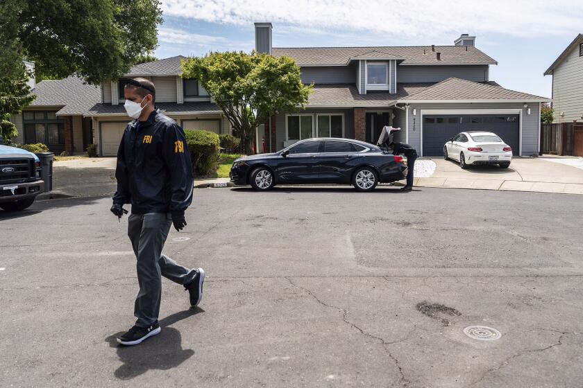 FBI personnel work on an investigation at a home registered to businessman Andy Duong in Oakland, Calif. on Thursday, June 20, 2024. Duong is a member of the family that owns recycling company Cal Waste Solutions, which has been investigated over campaign contributions to Oakland city Mayor Sheng Thao and other elected city officials, Oaklandside reported in 2020. (AP Photo/Noah Berger)