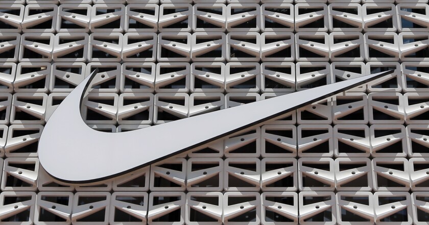The Nike logo hangs at a store.