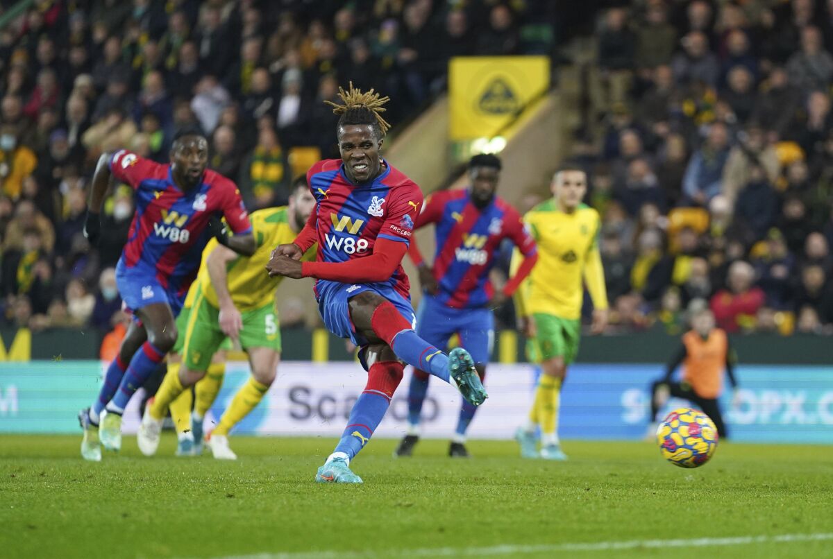 Crystal Palace's Wilfried Zaha misses a penalty during the English Premier League soccer match between Norwich City and Crystal Palace at Carrow Road, Norwich, England, Wednesday, Feb. 9, 2022. (Joe Giddens/PA via AP)