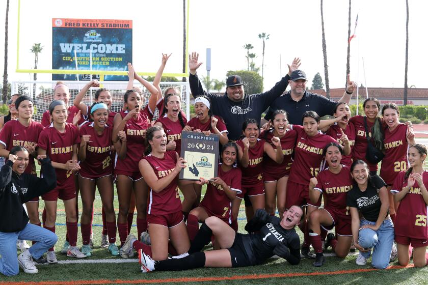 Estancia High School girls' soccer team and coaches pose for a picture after winning against Campbell Hall High School girls' soccer team in the CIF Ford Southern Section Championship game at El Modena High School in Orange on Saturday, February 24, 2024. (Photo by James Carbone)