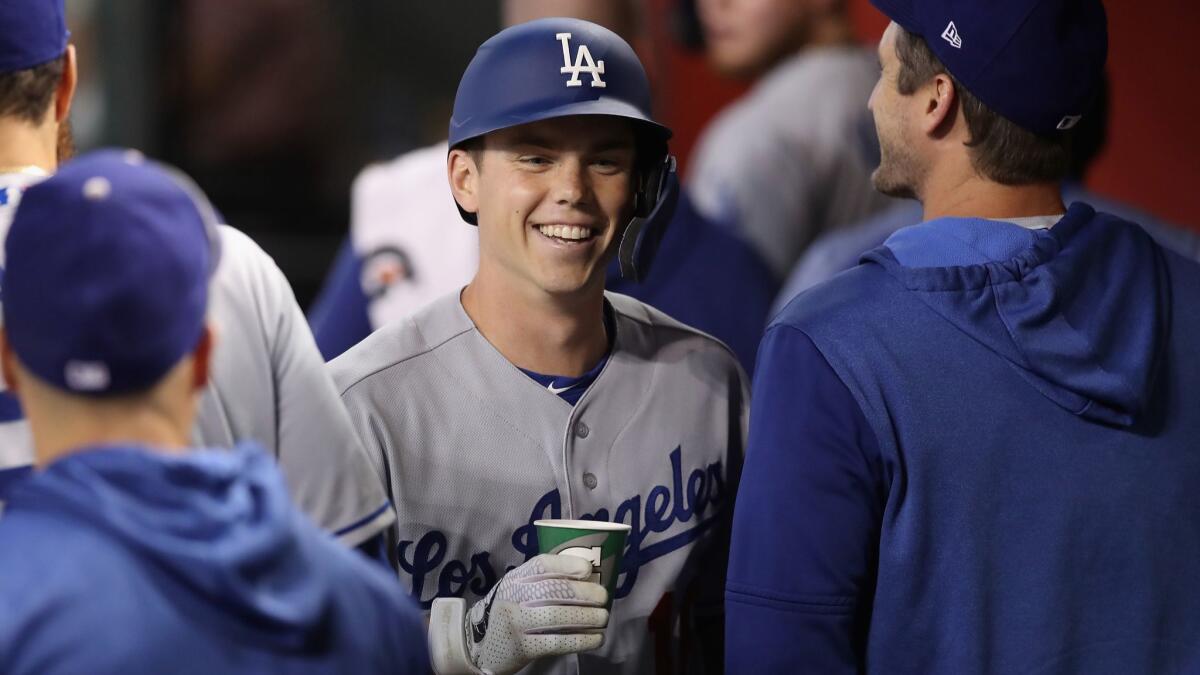 Dodgers catcher Will Smith reacts in the dugout after hitting a two-run home run against the Arizona Diamondbacks during the third inning on Wednesday in Phoenix.