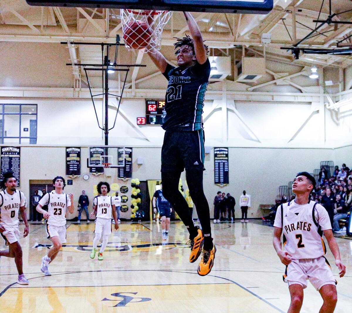 Narbonne High's Marcus Adams Jr. throws down a two-handed dunk.
