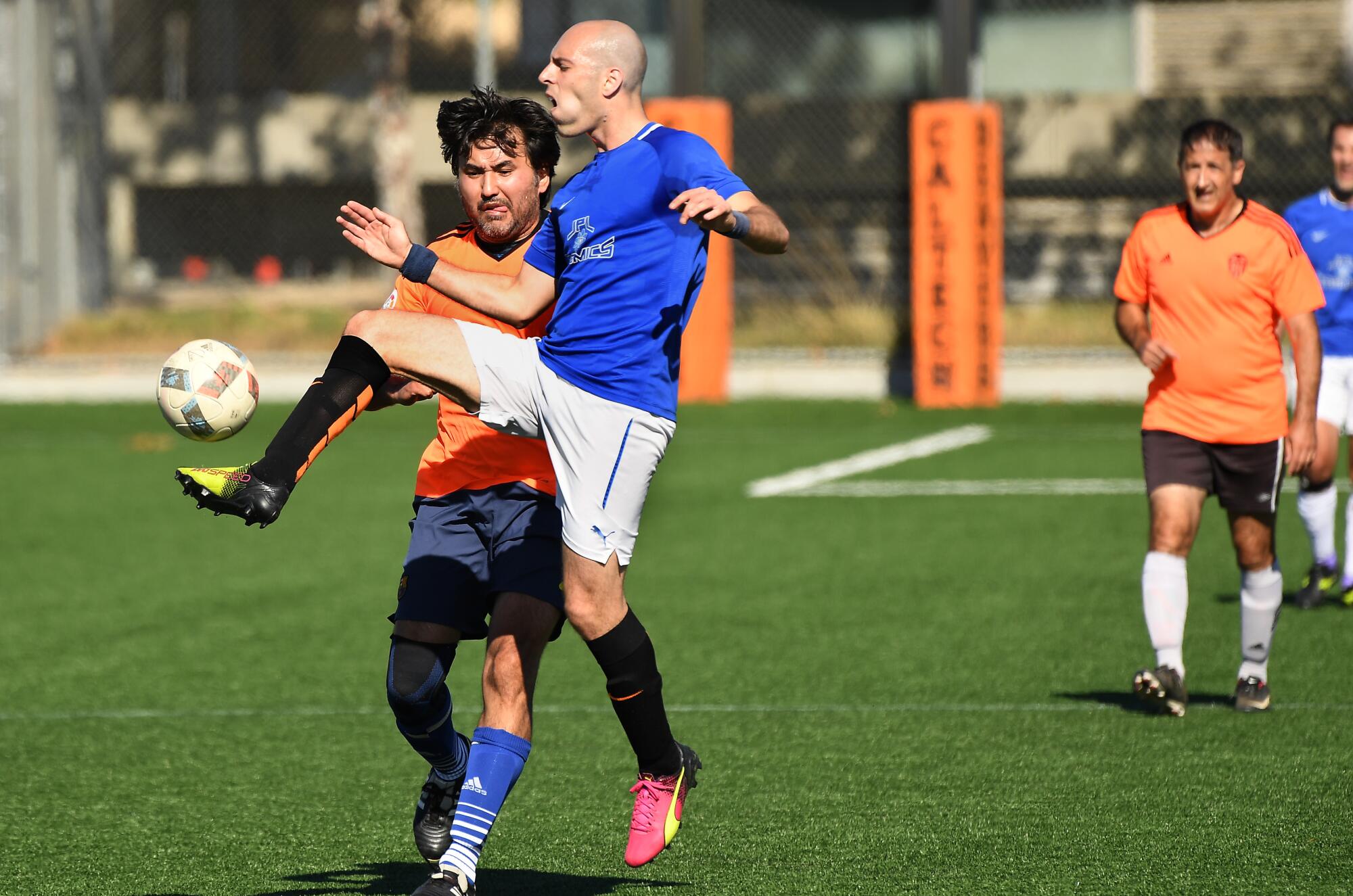 Marcello Gori, right, battles for the ball during a Nerd Soccer League game at Caltech in Pasadena.