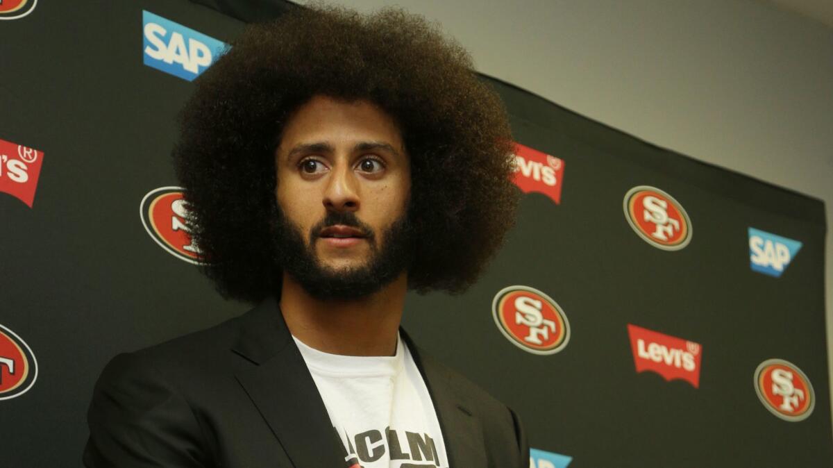 San Francisco quarterback Colin Kaepernick speaks at a news conference Sunday following the 49ers' loss to the Miami Dolphins.