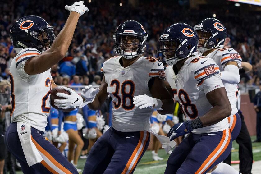 DETROIT, MI - NOVEMBER 22: Corner back Kyle Fuller #23 of the Chicago Bears celebrates his interception in the fourth quarter with teammates Adrian Amos #38 and Roquan Smith #58 during an NFL game against the Detroit Lions at Ford Field on November 22, 2018 in Detroit, Michigan. The Bears defeated the Lions 28-16. (Photo by Dave Reginek/Getty Images) ** OUTS - ELSENT, FPG, CM - OUTS * NM, PH, VA if sourced by CT, LA or MoD **