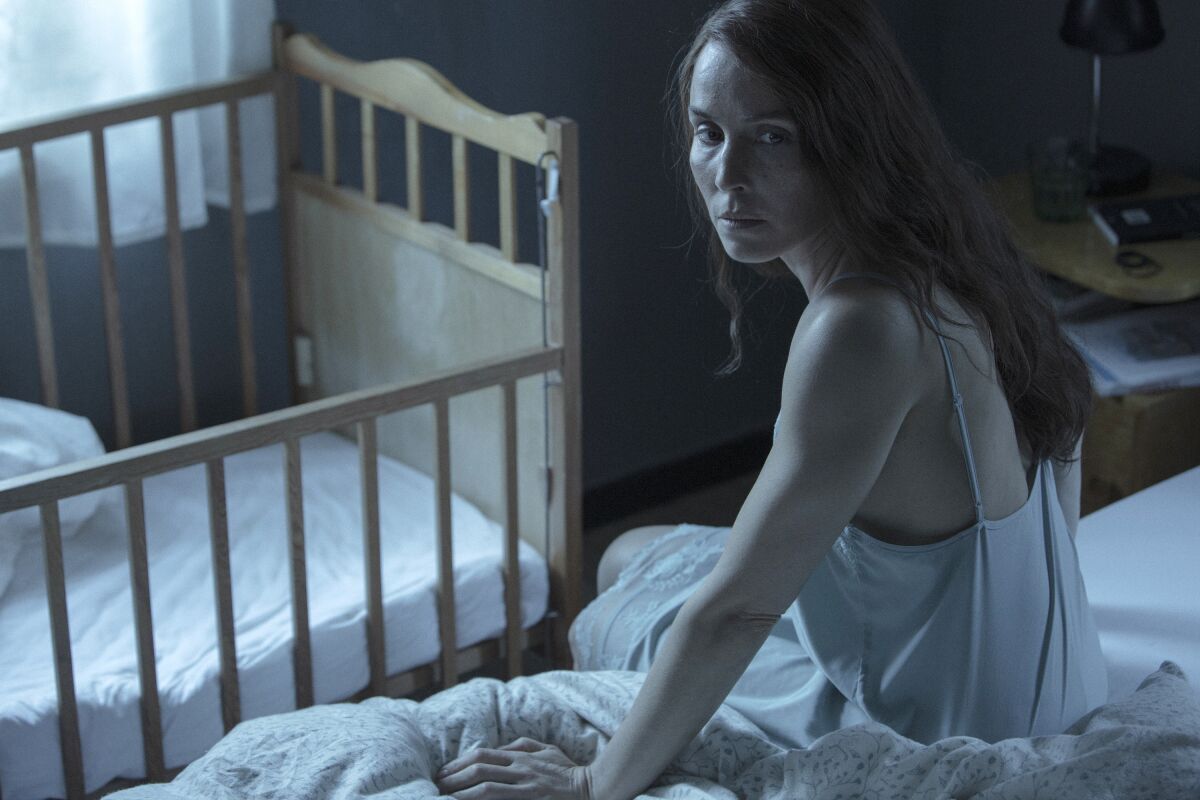 This image released by A24 shows Noomi Rapace in a scene from the film "Lamb." (A24 via AP)