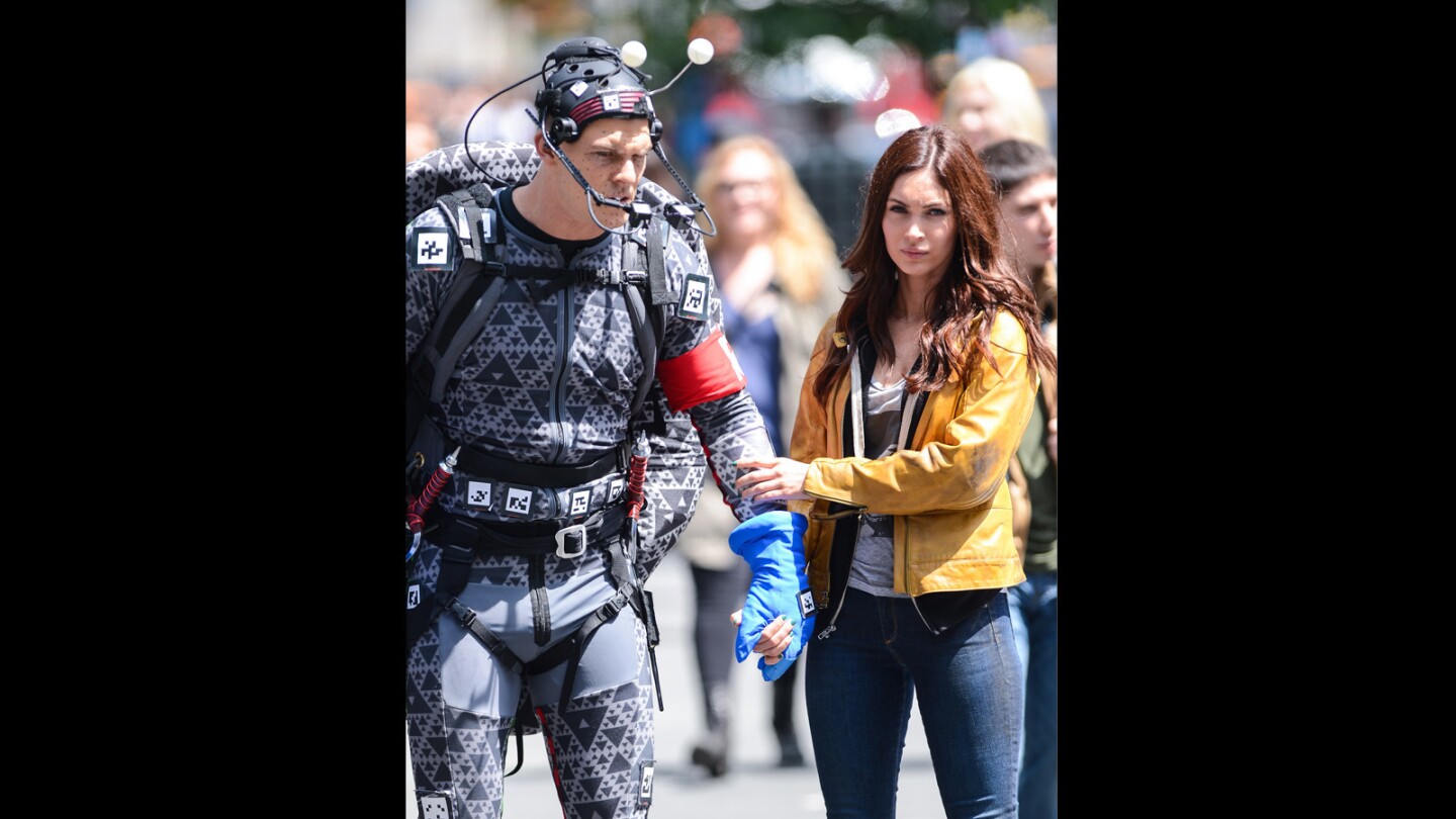 Actors Alan Ritchson and Megan Fox film a scene in Times Square, New York.