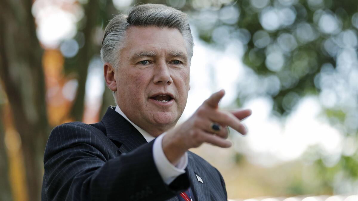 Mark Harris, shown Nov. 7, was ahead by 905 votes in unofficial results of North Carolina's contested 9th Congressional District race. Investigators are looking into whether people working on the Republican's behalf ran an illegal operation to collect voters' absentee ballots.
