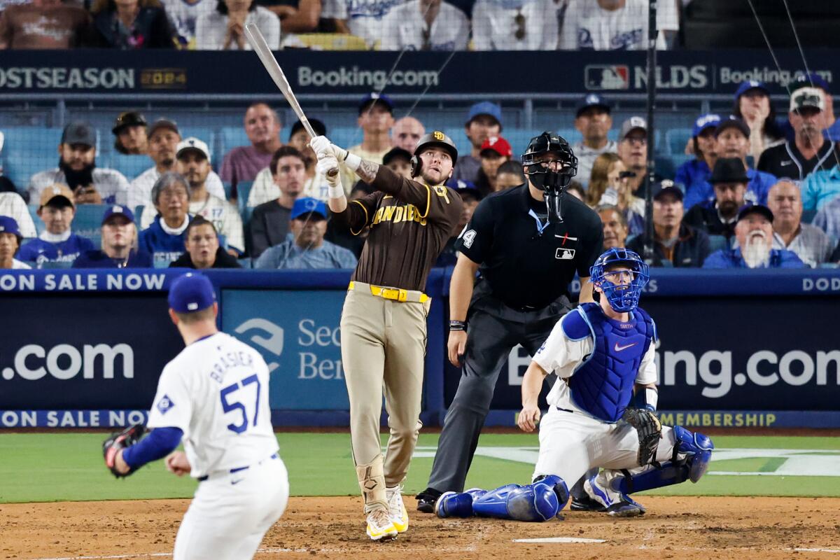 San Diego's Jackson Merrill hits a two-run home run in the eighth inning.