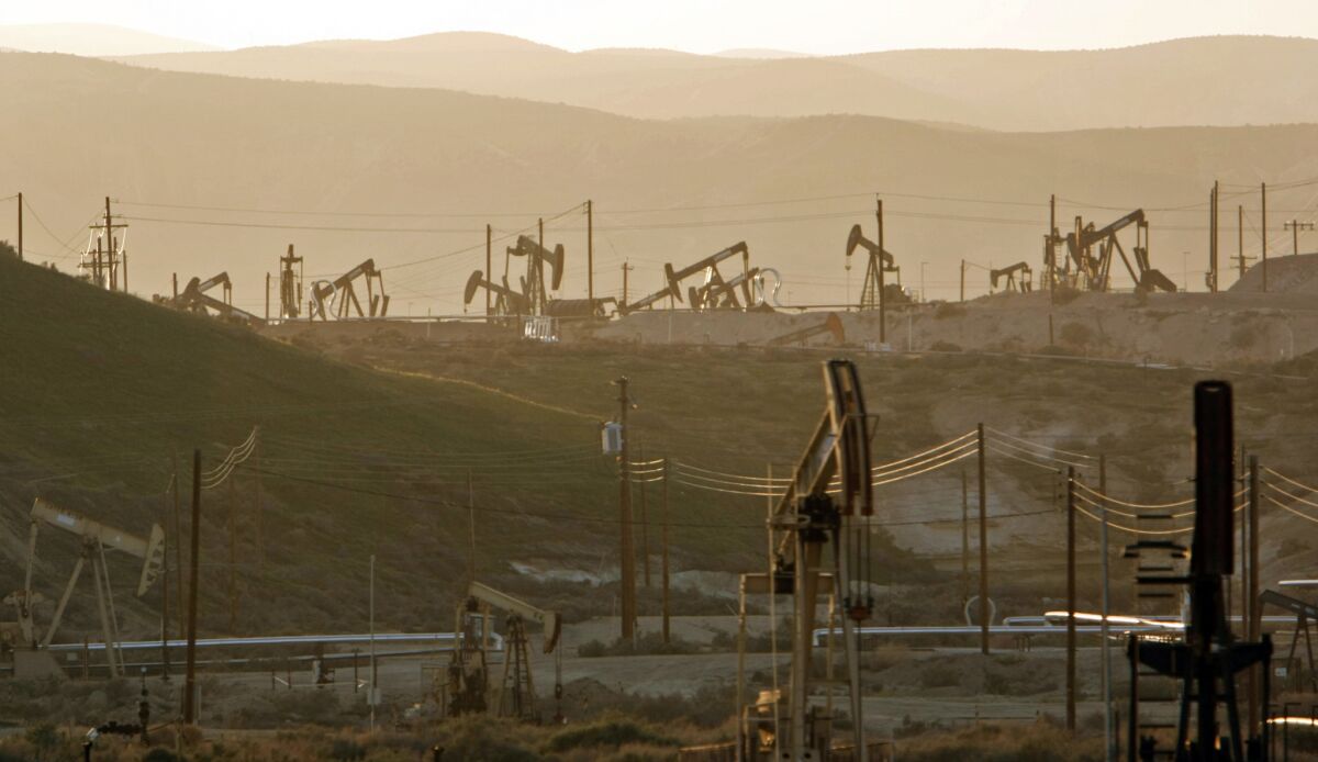 Oil rig pump jacks tap into the Monterey shale formation near Maricopa, Calif.