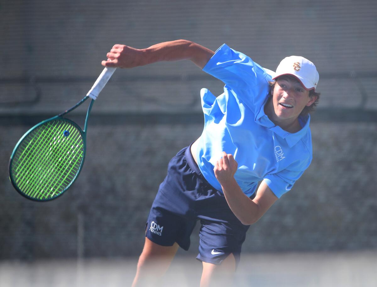 Corona del Mar No. 1 player Niels Hoffmann rips a serve in his match on Wednesday at University High in Irvine.