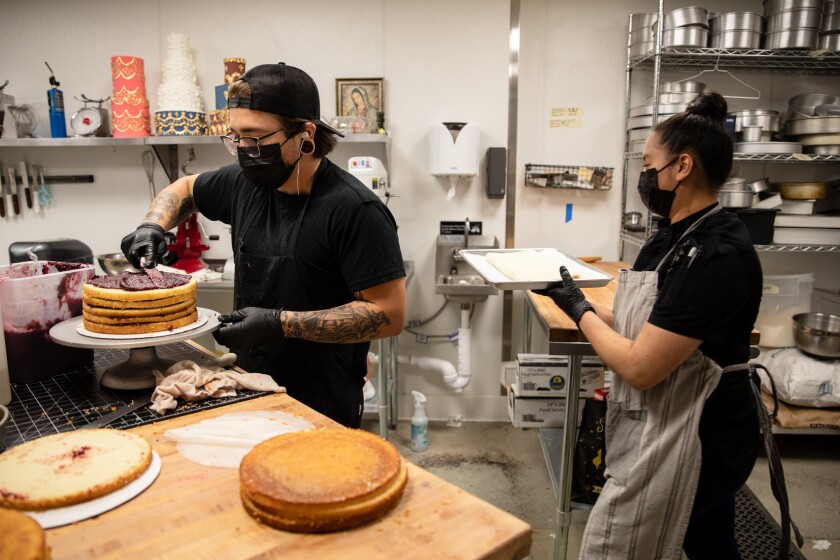 A layer cake being made in the kitchen at newly opened Mmm… Cakes in Chula Vista on Thursday, Oct. 21, 2021.