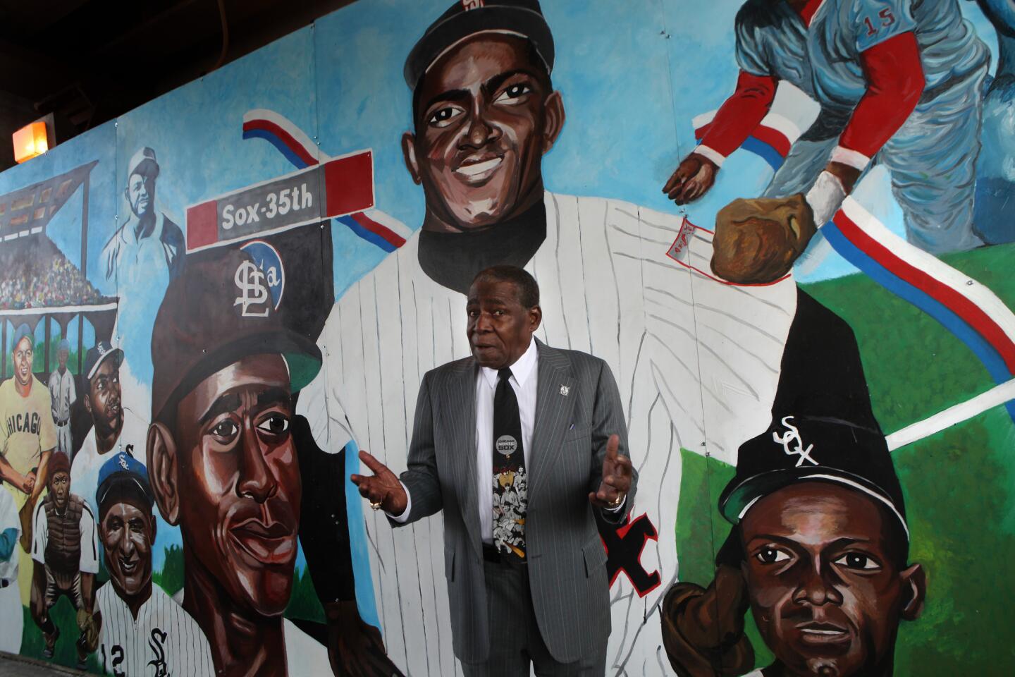 White Sox great Minnie Minoso, 82, visits the mural that features him prominently as the largest figure (see player directly behind him) in a series of African American ballplayers that was unveiled on 35th Street below the Metra tracks at Federal.