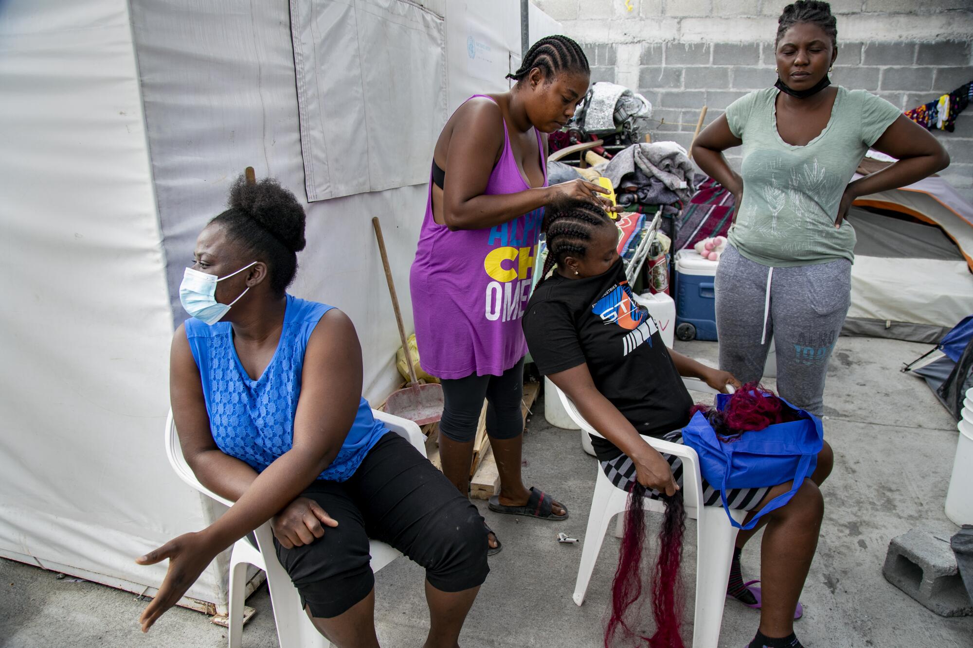 Haitian migrants seeking asylum mingle together