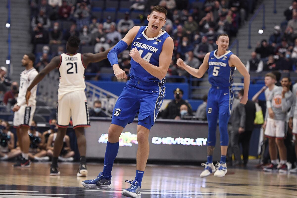 Creighton's Ryan Hawkins (44) reacts when his basket goes in at the buzzer ending the first half of an NCAA college basketball game against Connecticut, Tuesday, Feb. 1, 2022, in Hartford, Conn. (AP Photo/Jessica Hill)