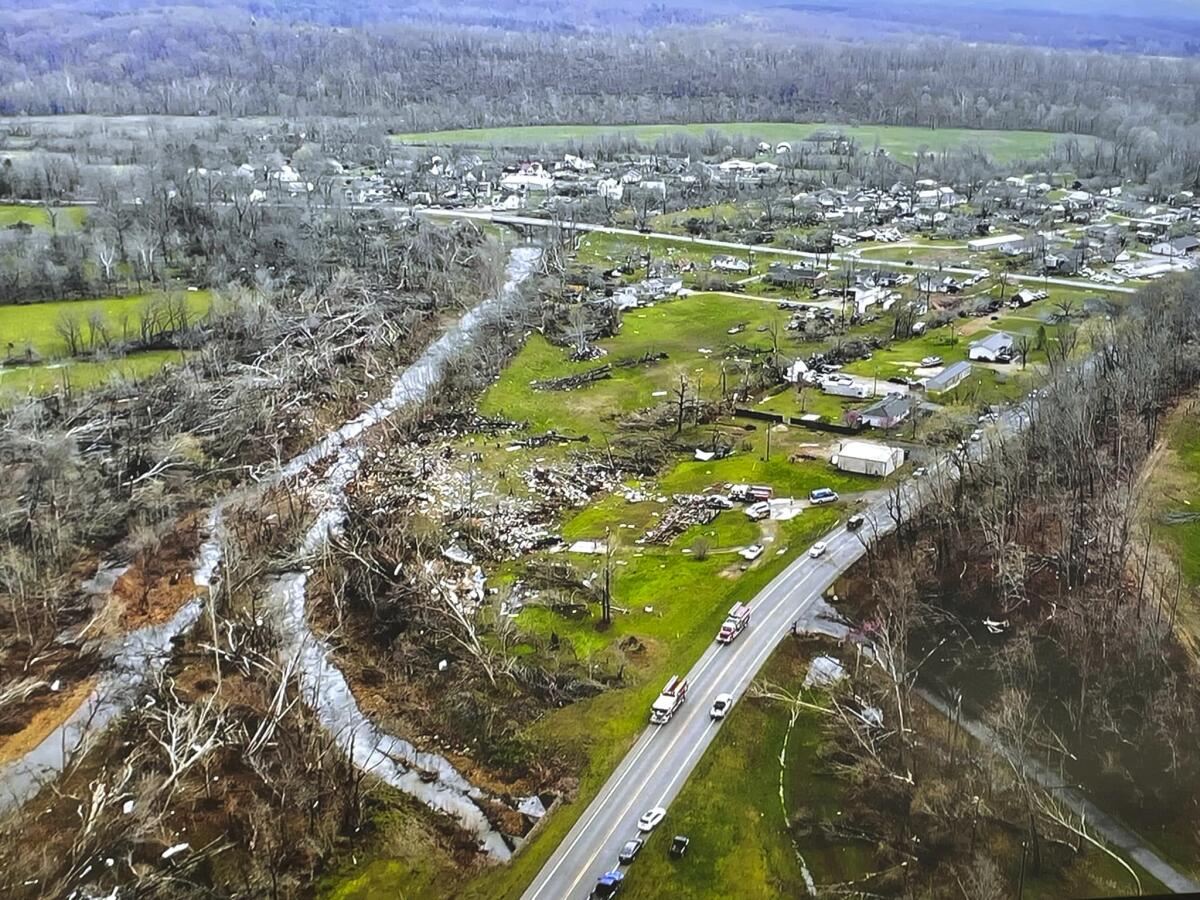 An aerial photo of damaged trees and buildings.