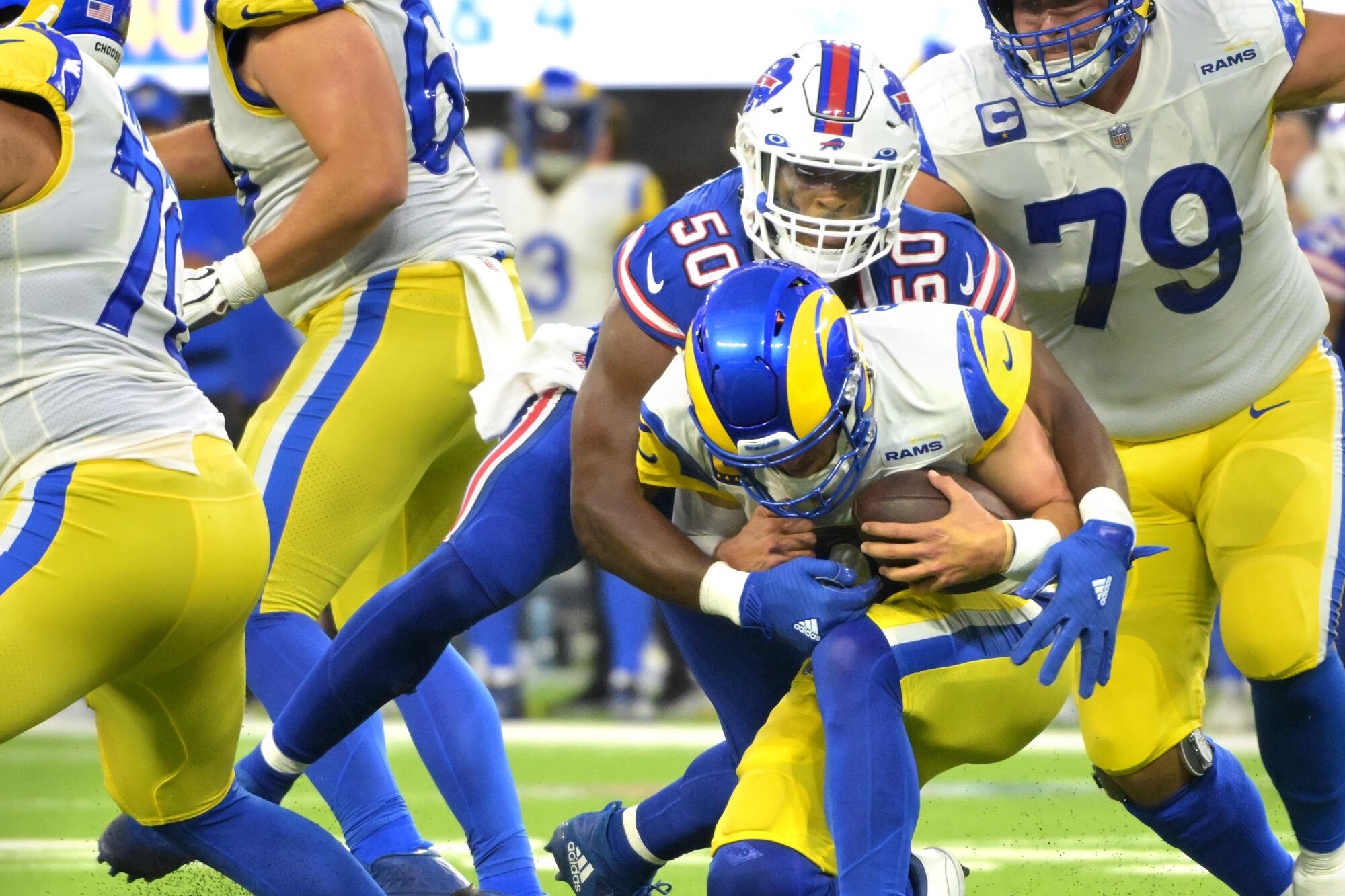 Rams quarterback Matthew Stafford is sacked by Bills defensive end Greg Rousseau.