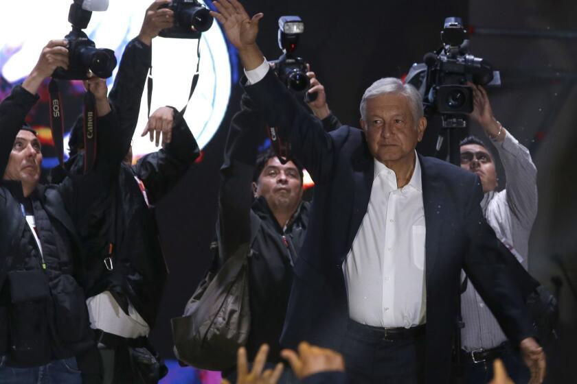 Presidential candidate Andres Manuel Lopez Obrador waves to supporters as he arrives to Mexico City's main square, the Zocalo, Sunday, July 1, 2018. Mexican voters have elected Lopez Obrador as their new president, after an election driven by widespread frustration and anger of the country's corruption and violence. (AP Photo/Moises Castillo)