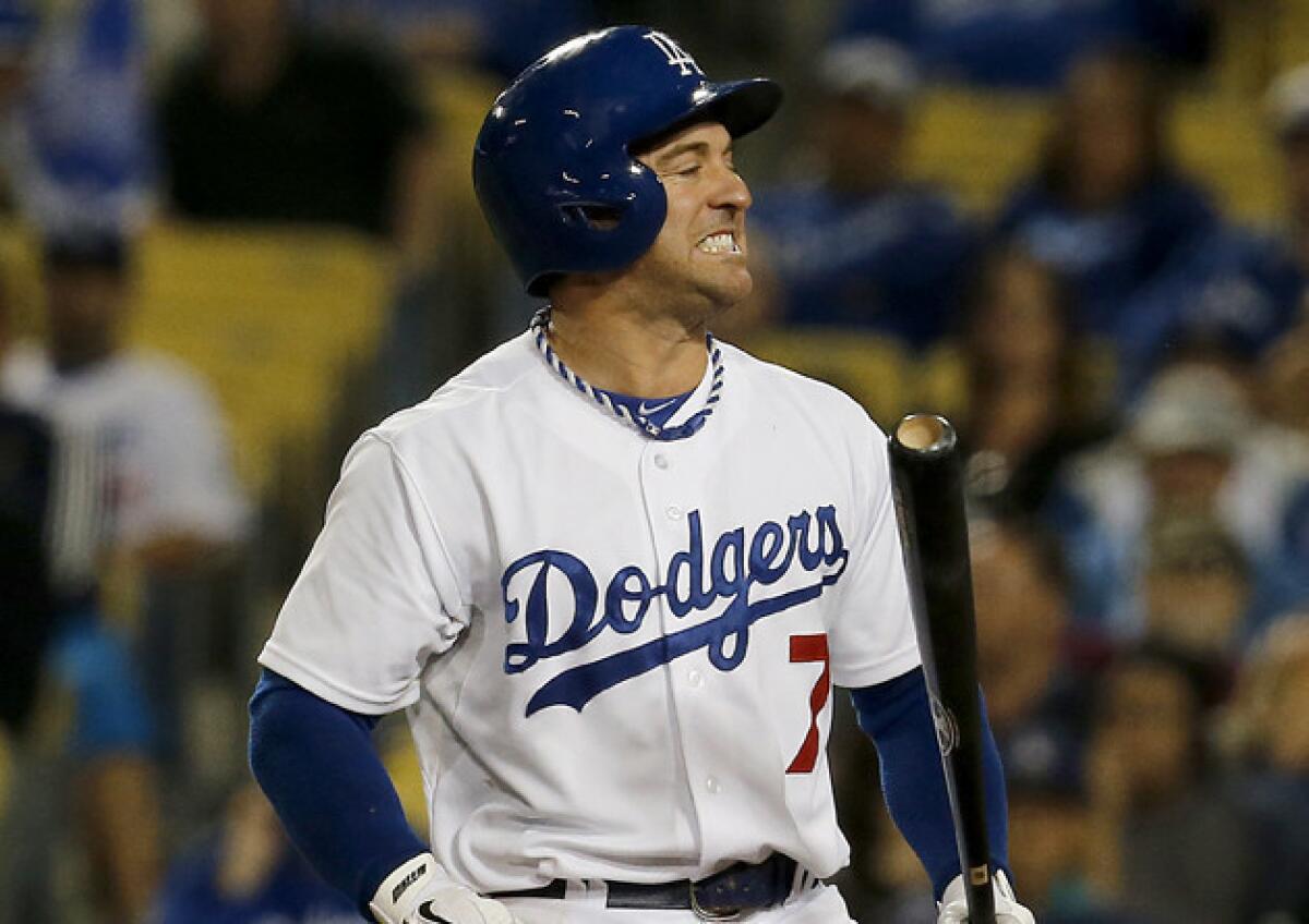Dodgers' Nick Punto reacts after striking out to end the game against the Miami Marlins on Friday.