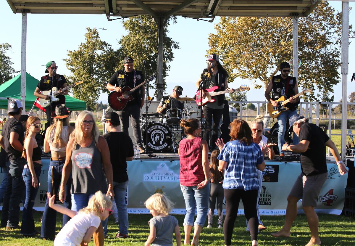Redneck Rodeo Orange County performs at Costa Mesa's Concert in the Park event at Fairview Park in Costa Mesa on Tuesday.