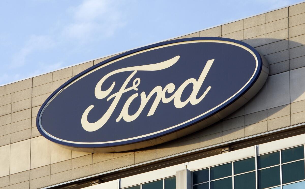 The Ford logo on the automaker's headquarters.