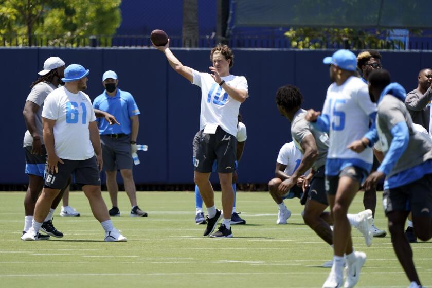 Los Angeles Chargers quarterback Justin Herbert (10) throws during the NFL football team's organized team activities Tuesday, June 1, 2021, in Costa Mesa, Calif. (AP Photo/Marcio Jose Sanchez)
