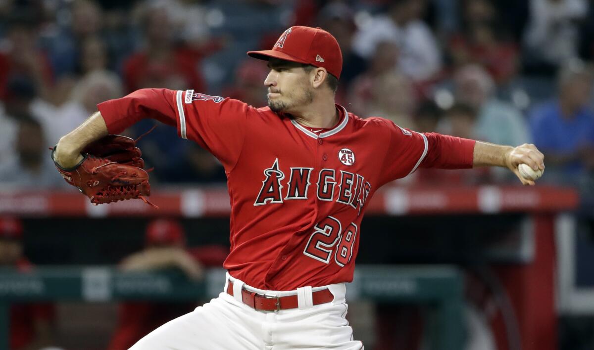 Angels starting pitcher Andrew Heaney throws to a Texas Rangers batter during the second inning on Aug. 27, 2019 at Angel Stadium. 