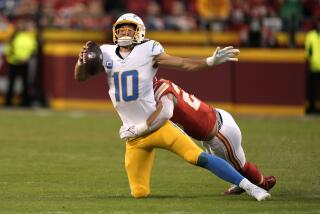 Los Angeles Chargers quarterback Justin Herbert (10) is sacked by Kansas City Chiefs.