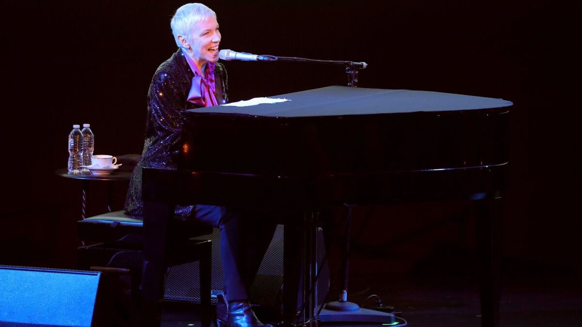 Annie Lennox performed at the 2017 LACMA Art + Film Gala wearing a custom black Gucci tuxedo with sequin peak lapels worn over a purple silk shirt with a bow at the neck.