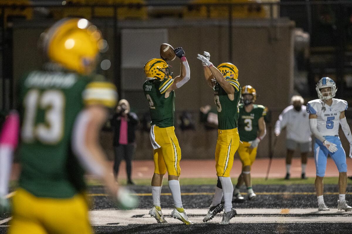 Edison's Nico Brown, right, leaps in the air with Tucker Tripp after he scored a touchdown in the second half.